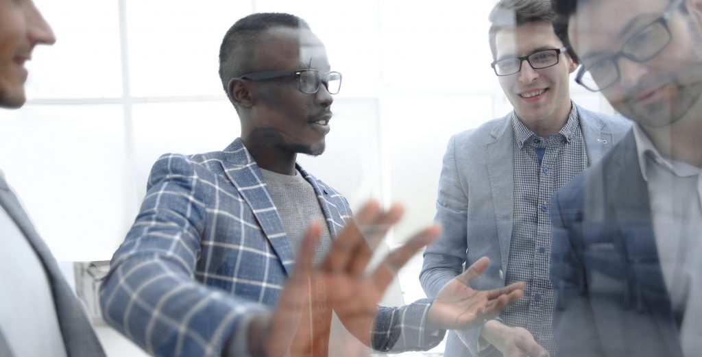 Group of male leaders communicate with influence